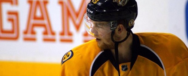 Ryan Ellis lays out Wayne Simmonds during Saturday's game against the Philadelphia Flyers.