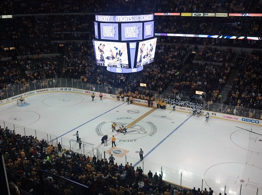 Cici Collins drops the puck